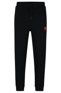 HUGO - Cotton-terry tracksuit bottoms with red logo label