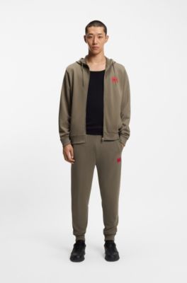 Pantalones de ch&aacute;ndal en felpa de algod&oacute;n con etiqueta con logo roja, Marr&oacute;n