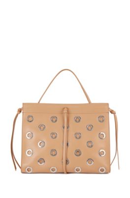 Hugo Boss Metallic-eyelet tote bag in leather with lace details. 2