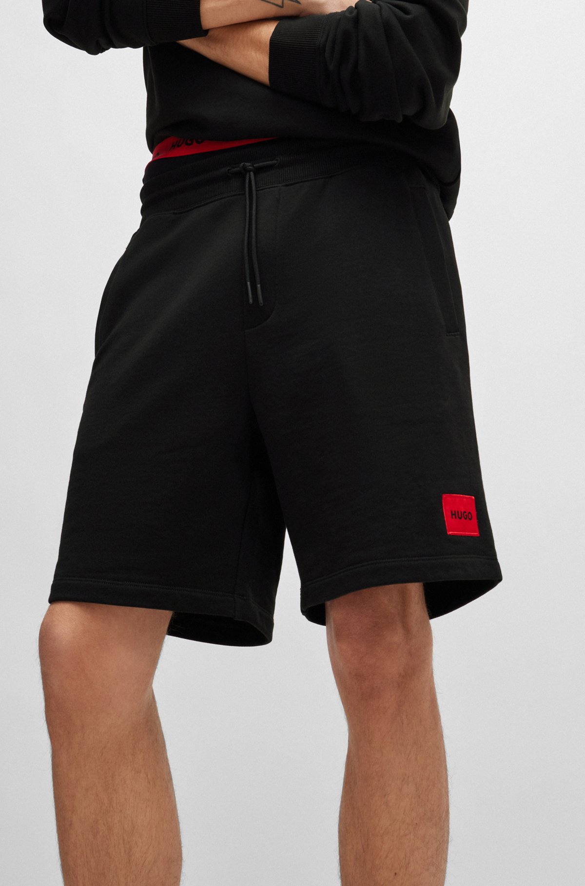 French-terry-cotton shorts with red logo label, Black