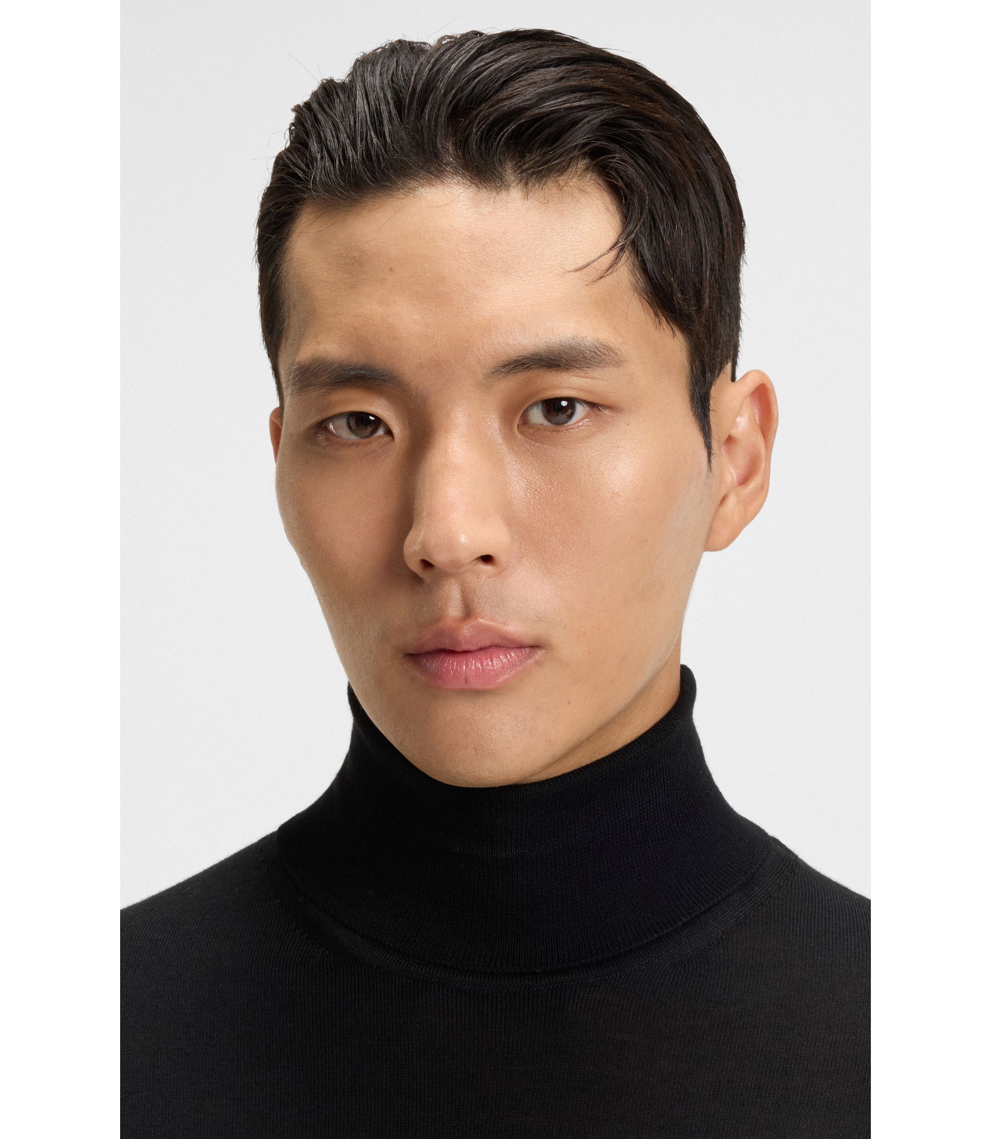 BOSS - Merino-wool rollneck sweater in a slim fit - Black