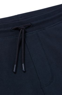 Pantalones de ch&aacute;ndal en felpa de algod&oacute;n con parche de logo, Azul oscuro