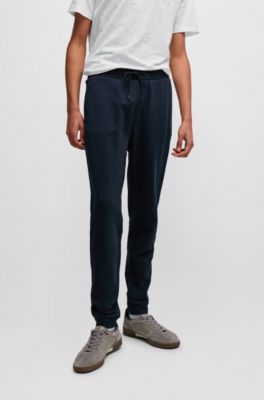 Pantalones de ch&aacute;ndal en felpa de algod&oacute;n con parche de logo, Azul oscuro