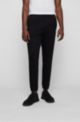 Cotton tracksuit bottoms with curved logo, Black