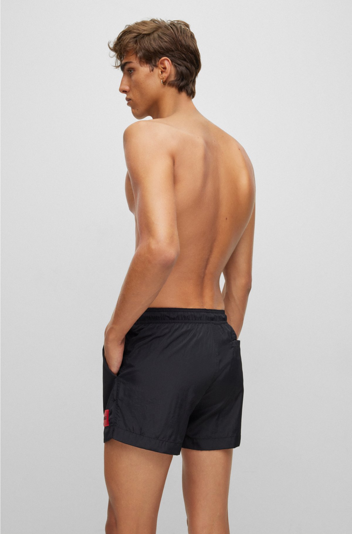 Quick-dry swim shorts with red logo label, Black