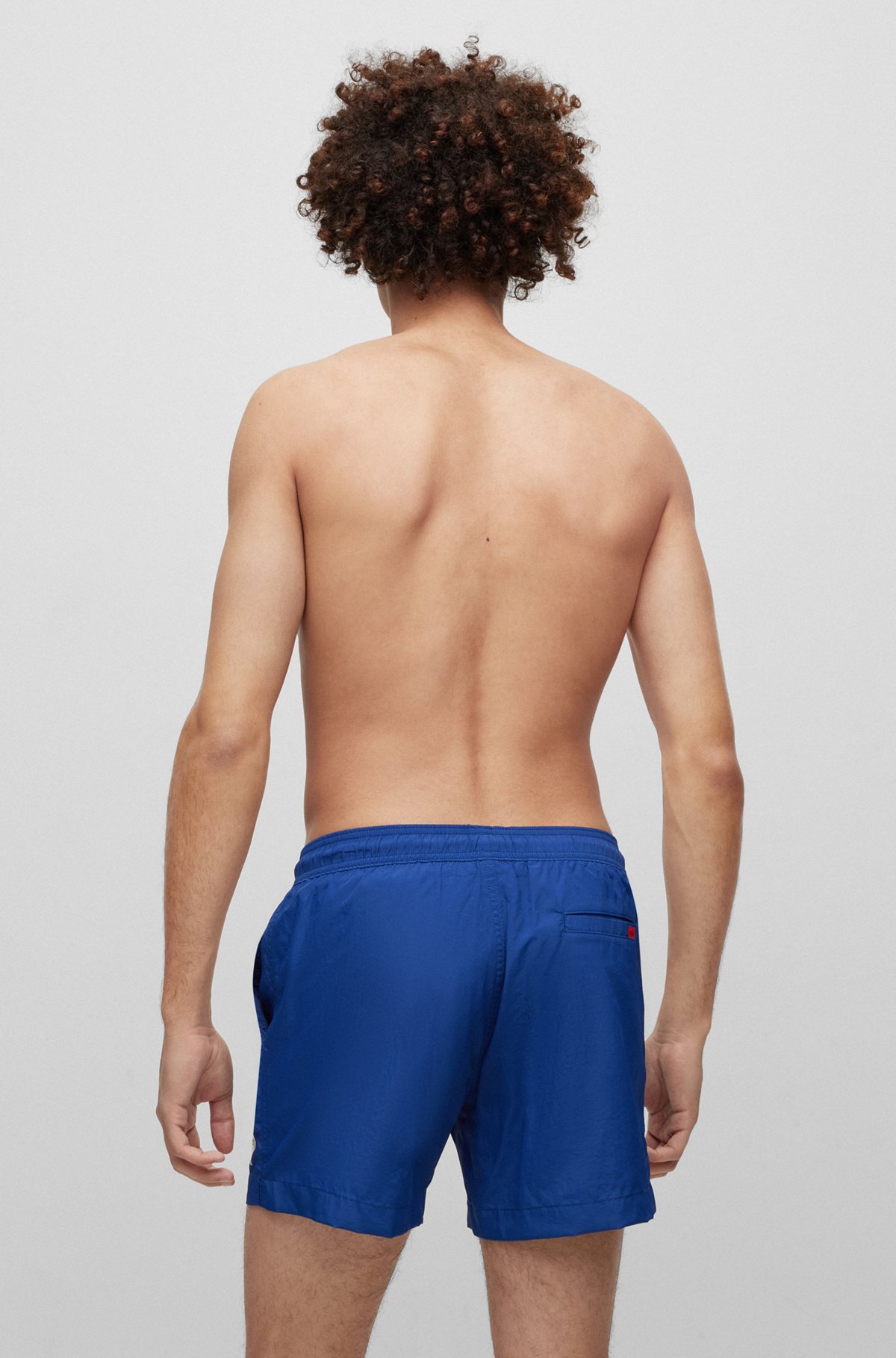 Quick-dry swim shorts with red logo label, Blue