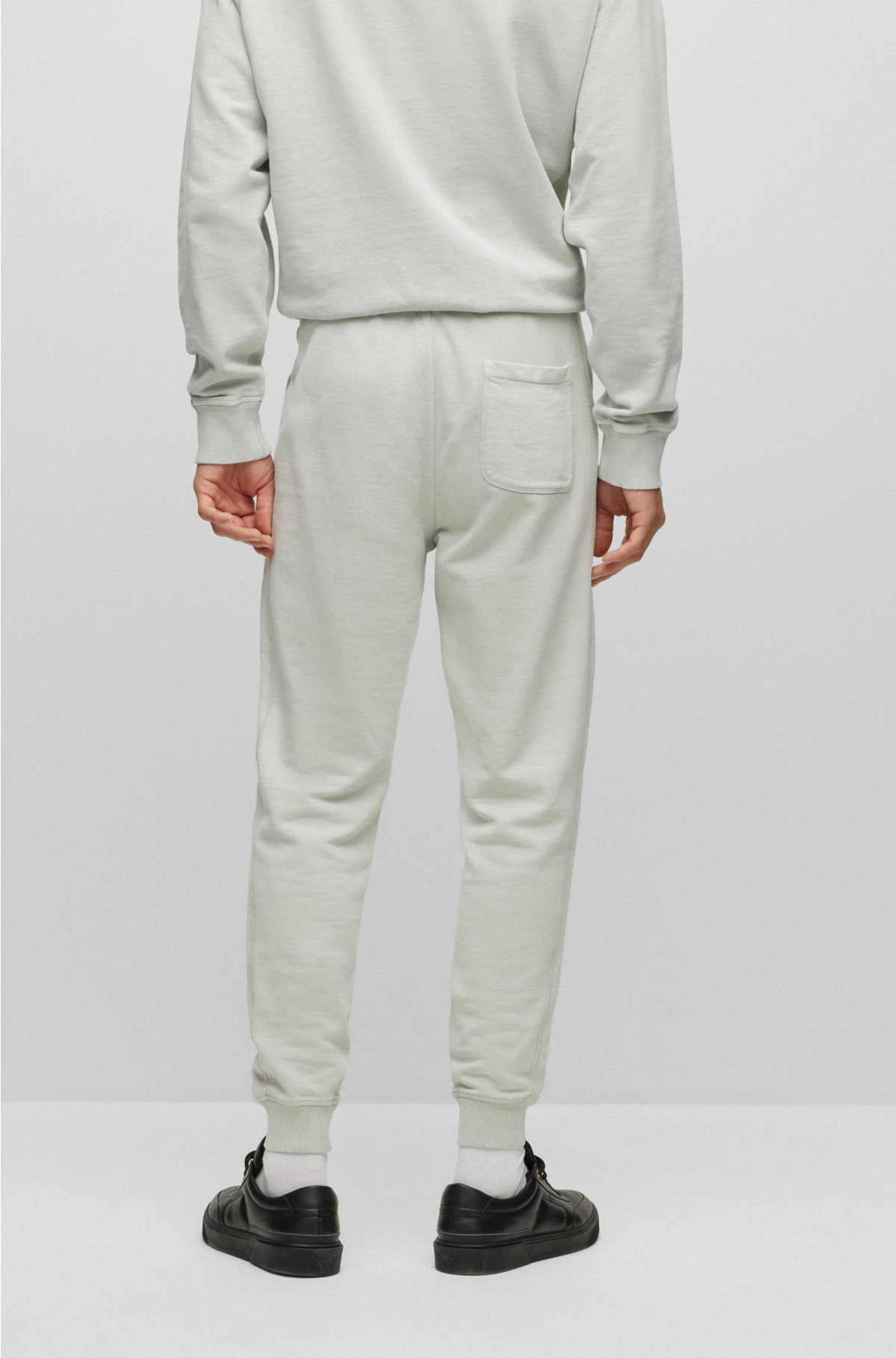 Alegrarse girar farmacéutico BOSS - Relaxed-fit tracksuit bottoms in French-terry cotton