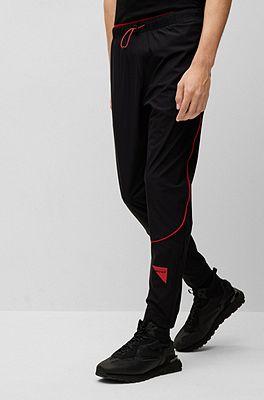 HUGO - Regular-fit logo bottoms tracksuit with capsule and piping