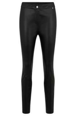 Skinny fit: faux leather trousers - black