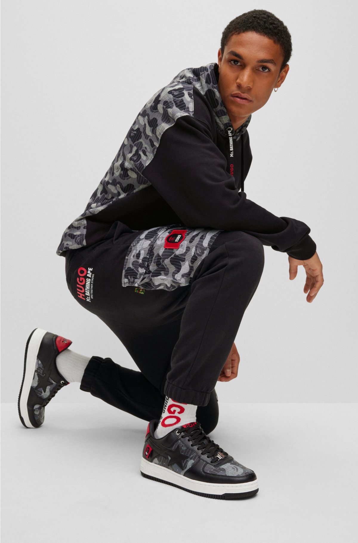 HUGO - Cotton-jersey tracksuit bottoms with camouflage pattern