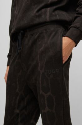 HUGO - Cotton-jersey tracksuit bottoms with camouflage pattern