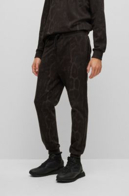 HUGO - Cotton-jersey tracksuit bottoms with camouflage pattern