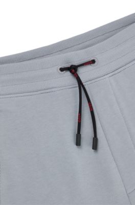 Bas de surv&ecirc;tement en molleton de coton avec logo, Gris