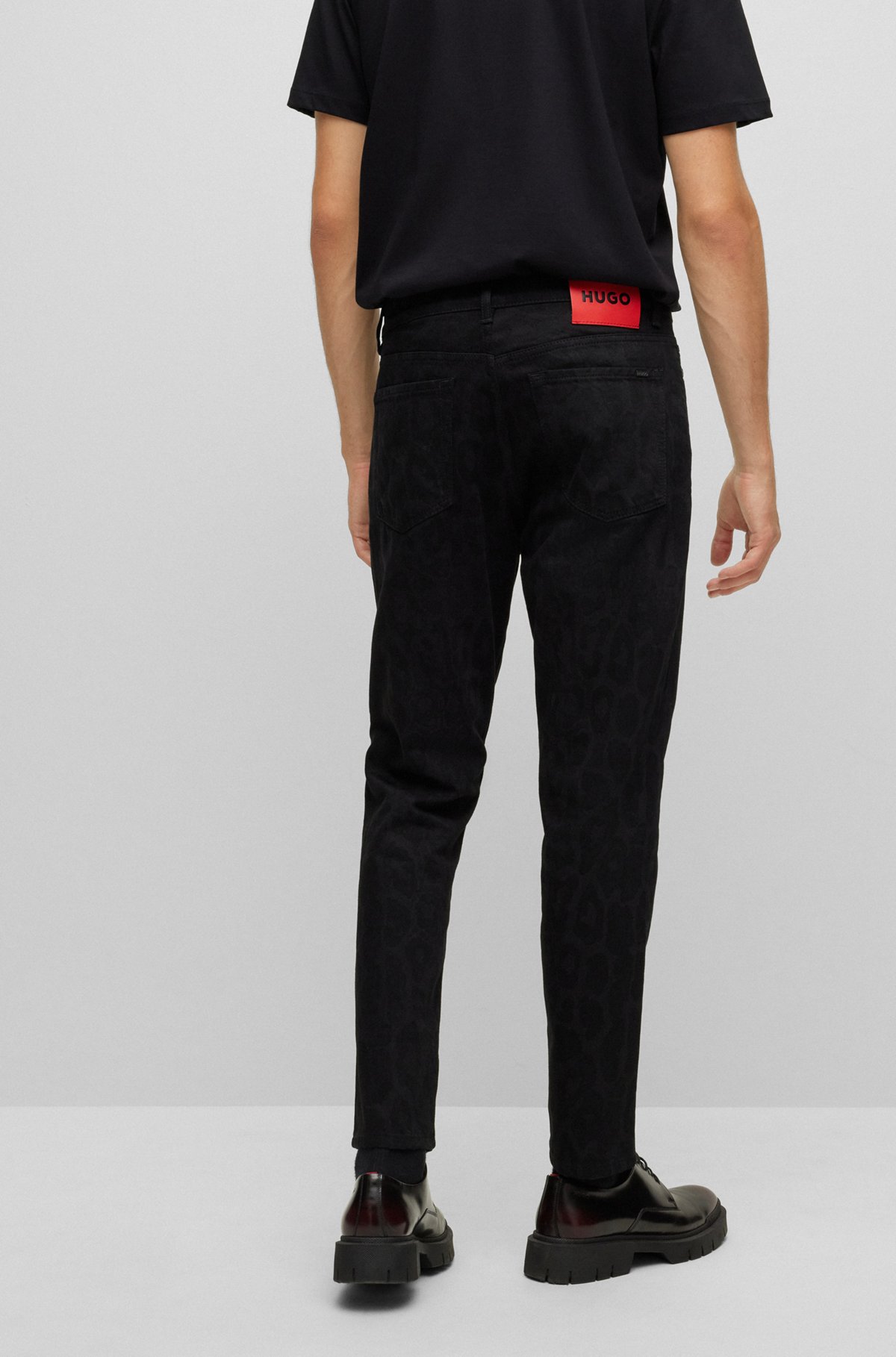 HUGO - Tapered-fit jeans in jaglion-print rigid denim