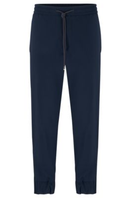 BOSS - Slim-fit trousers in bi-stretch softshell material