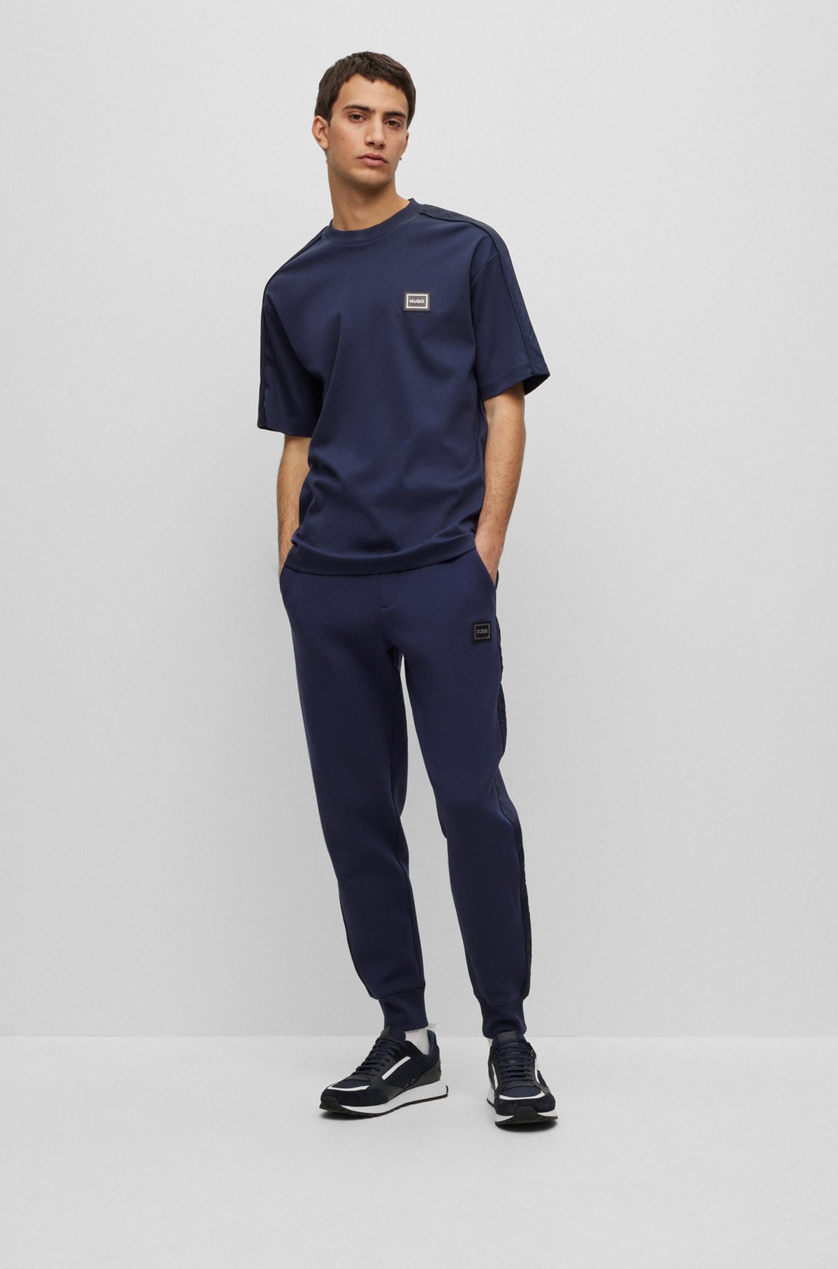 HUGO - Cotton-blend cuffed tracksuit bottoms with side stripes