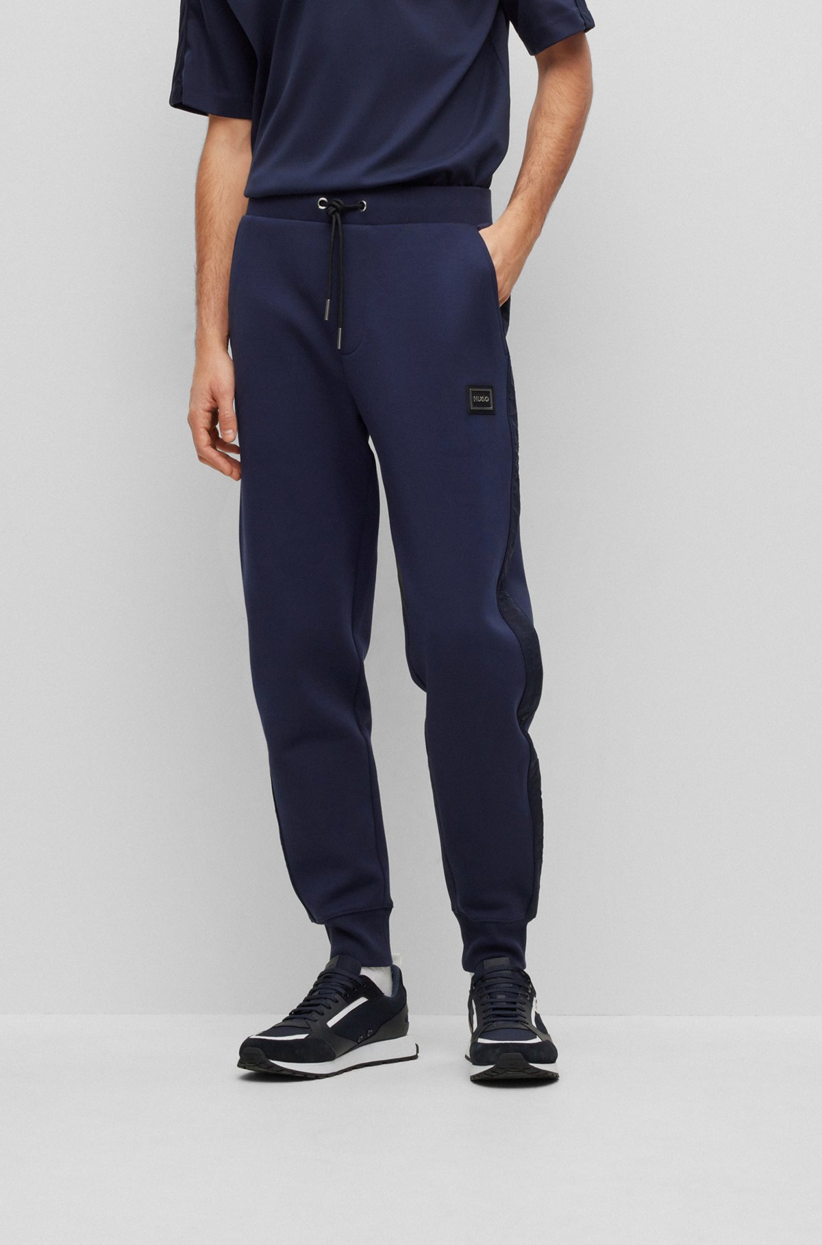 HUGO - Cotton-blend cuffed tracksuit bottoms with side stripes
