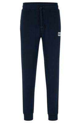 BOSS - Cuffed tracksuit bottoms in French terry with logo print