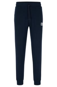 BOSS Cuffed tracksuit bottoms in French terry with logo print