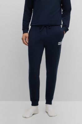 Hugo Boss Cuffed Tracksuit Bottoms In French Terry With Logo Print In Dark Blue