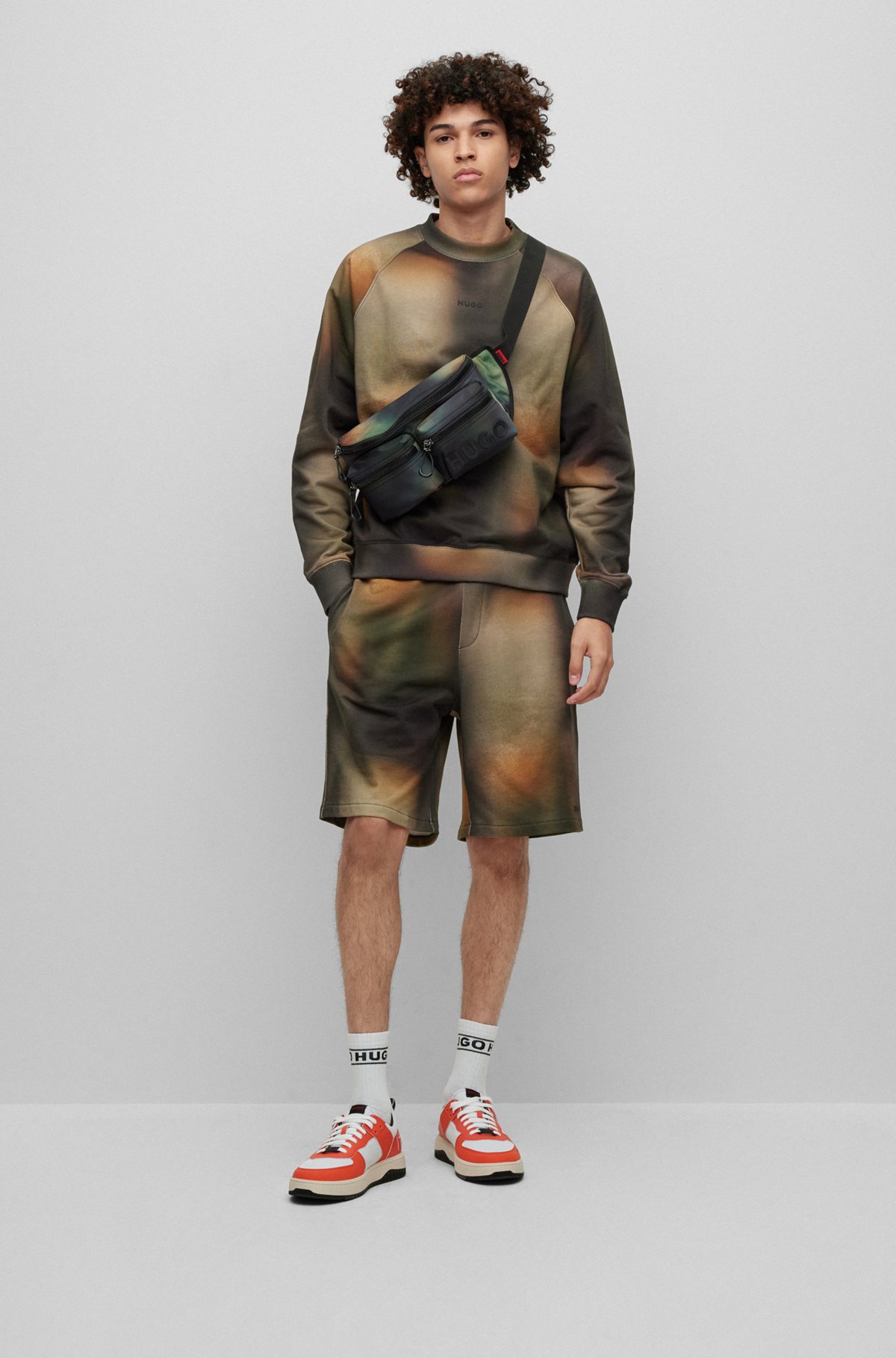 HUGO - Cotton-terry sweatshirt with bleach-effect camouflage print