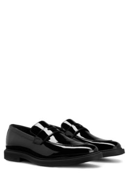- loafers with black-and-gold logo detail