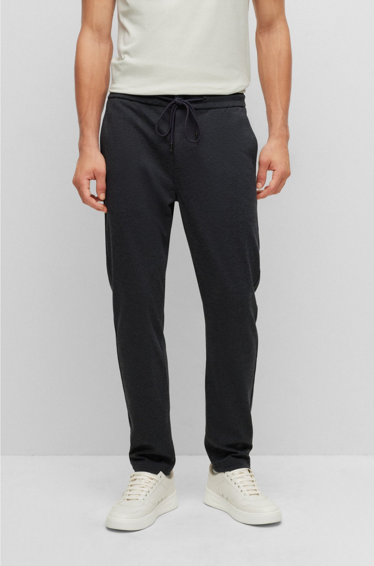- Tapered-fit tracksuit bottoms in stretch jersey