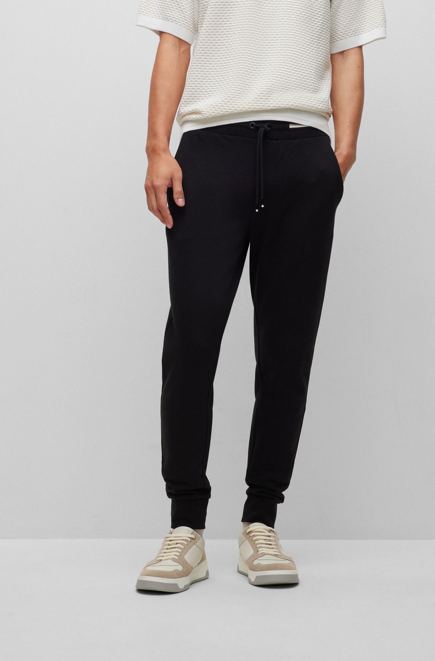 Cotton tracksuit bottoms with signature-stripe waistband