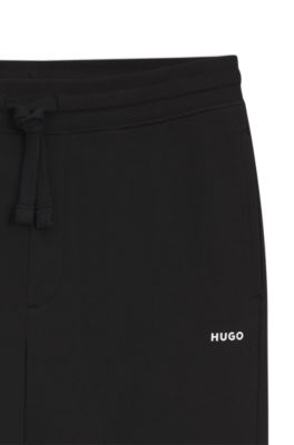 Pantalones casuales de algod&oacute;n con pu&ntilde;os el&aacute;sticos, Negro