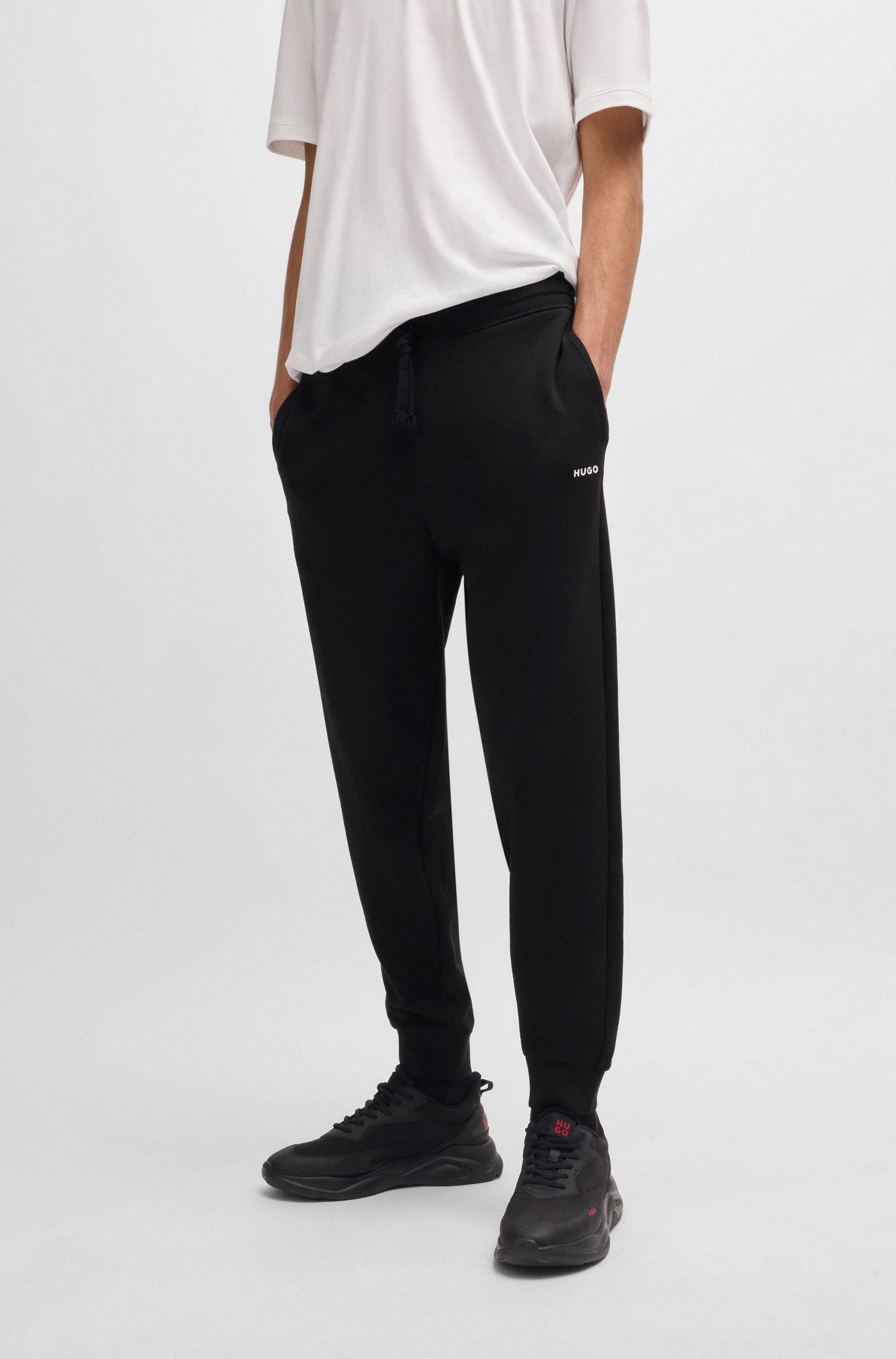 Cotton-terry tracksuit bottoms with logo print