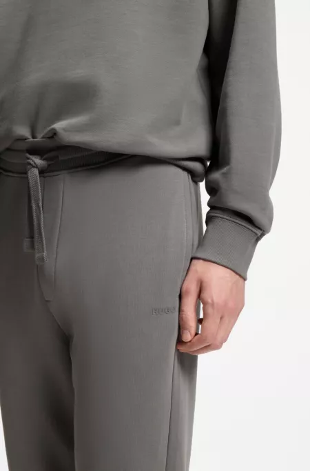 Cuffed sweatpants in cotton terry with logo print