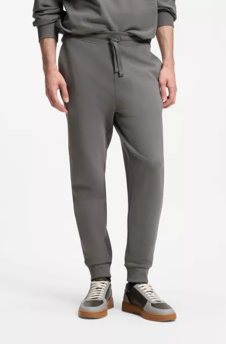 Cuffed sweatpants in cotton terry with logo print