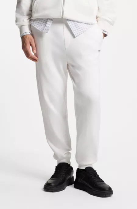 Cuffed sweatpants in cotton terry with logo print