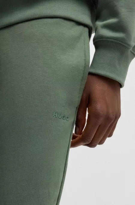 Cuffed sweatpants in cotton terry with logo print