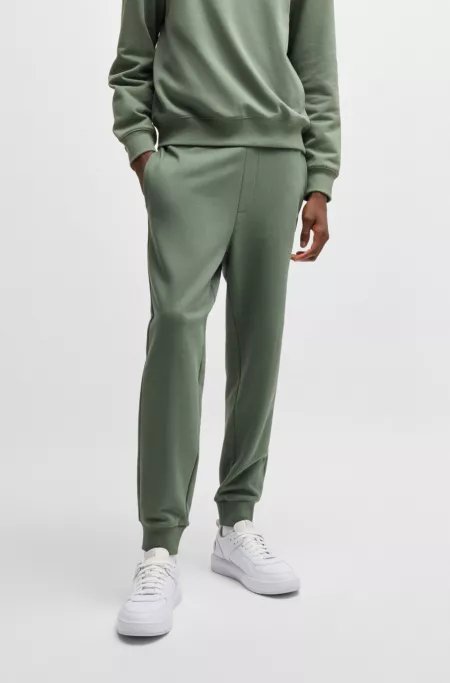 Cuffed sweatpants in cotton terry with logo print