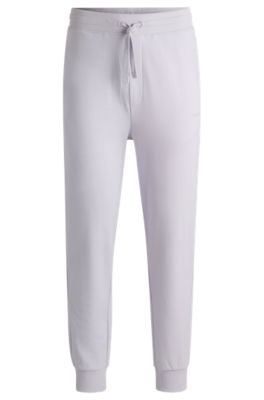 Pantalones de ch&aacute;ndal en felpa de algod&oacute;n con pu&ntilde;os y logo estampado, Luz p&uacute;rpura