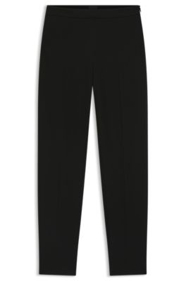 Pantalones regular fit en tejido el&aacute;stico con corte c&oacute;nico, Negro