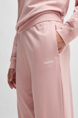 Cuffed tracksuit bottoms with logo print, light pink