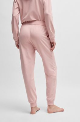 Cuffed tracksuit bottoms with logo print, light pink