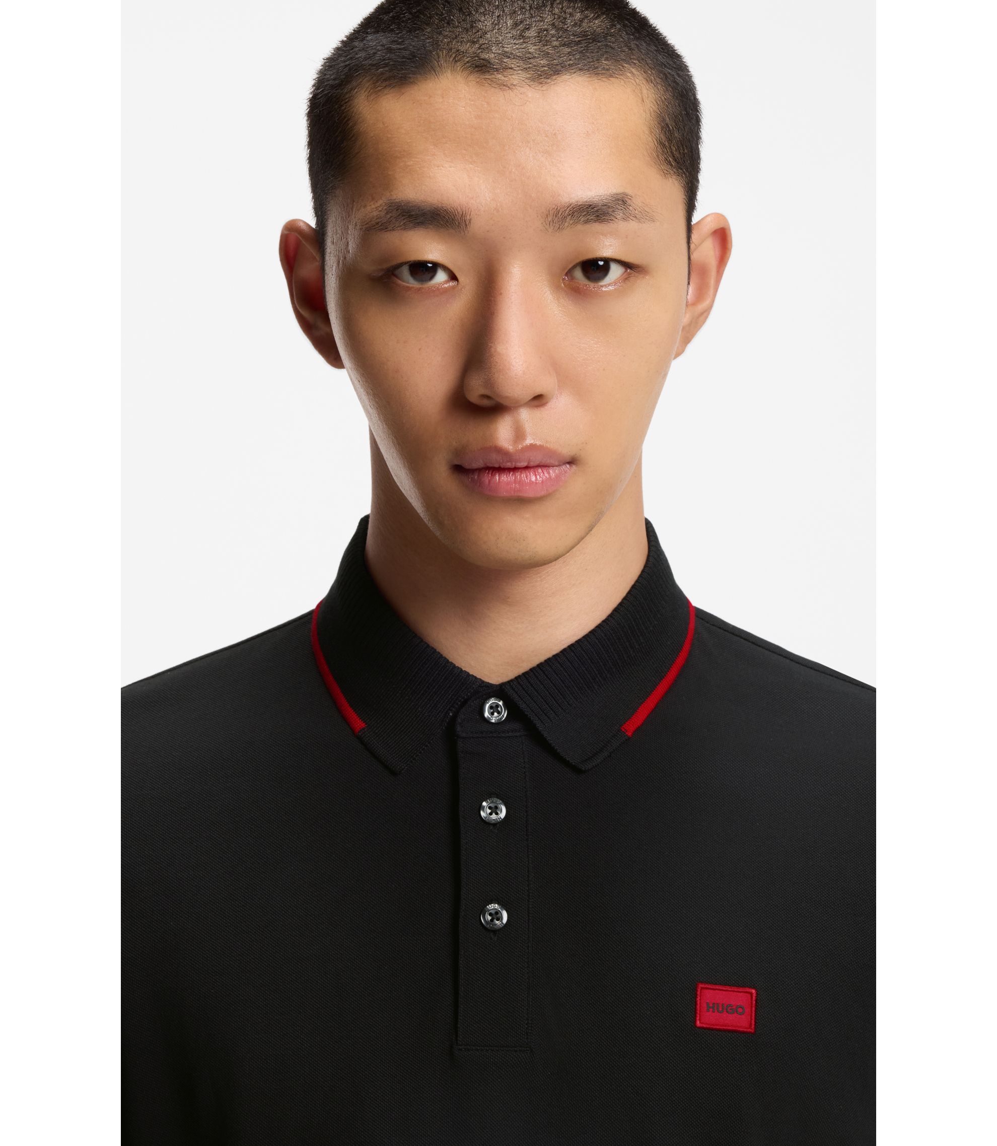 HUGO Cotton-piqué slim-fit polo shirt with red logo label Black