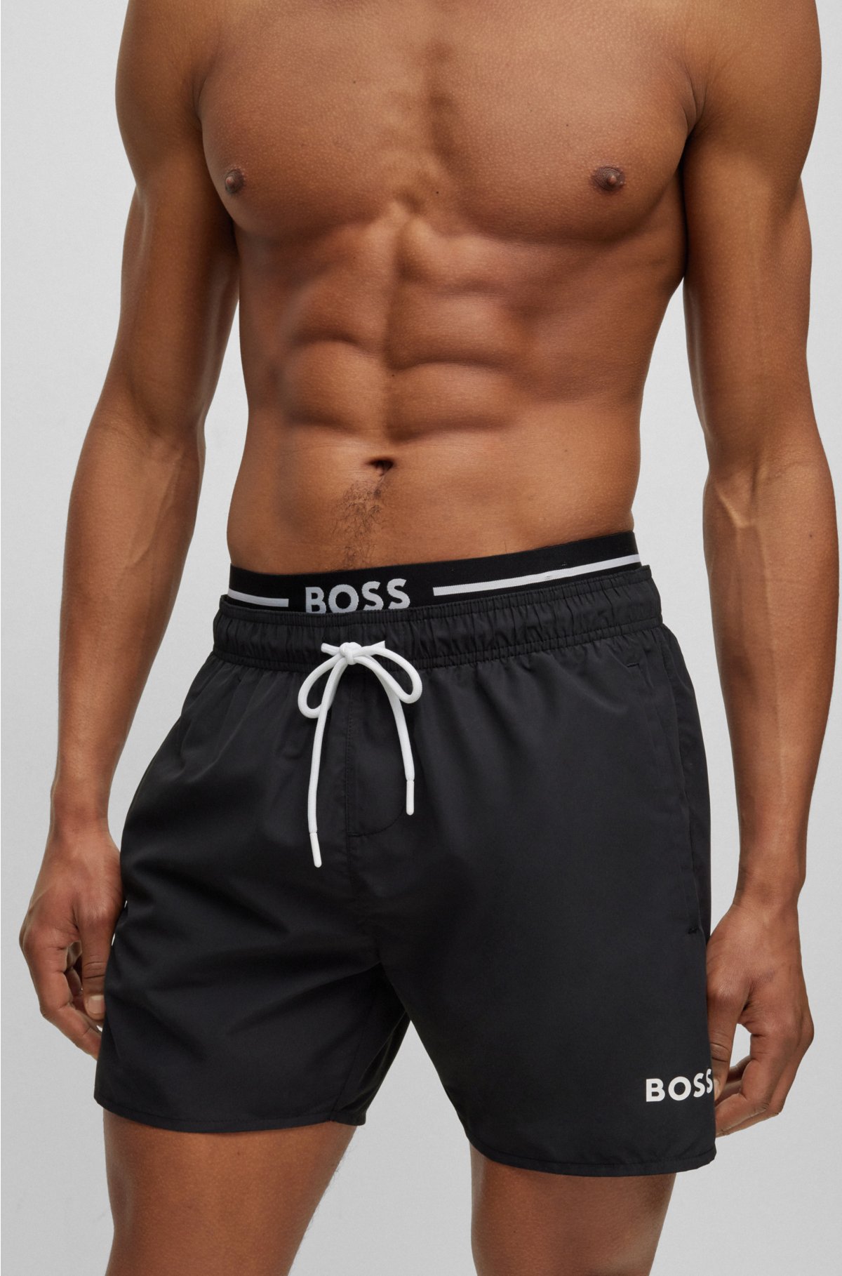 BOSS - Quick-dry swim shorts in recycled fabric with branding