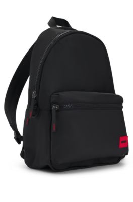Backpack with red rubber logo label and top handle, Black