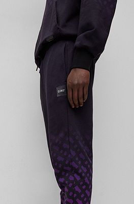 BOSS - Oversize-fit tracksuit bottoms with contrast waistband