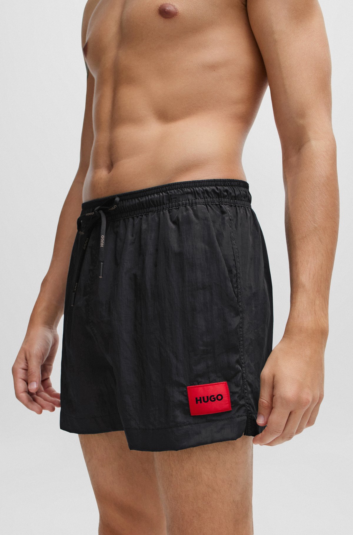 Quick-drying swim shorts in recycled material with logo, Black