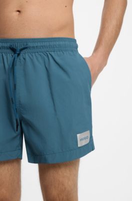 Quick-drying swim shorts in recycled material with logo, Turquoise