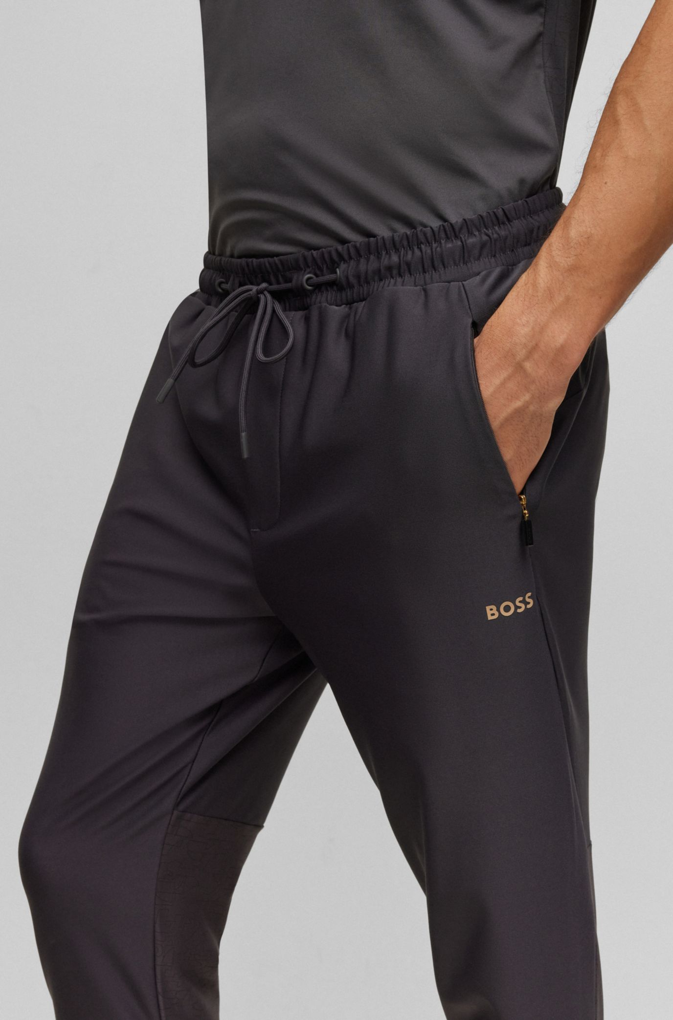 BOSS - Regular-fit tracksuit bottoms with decorative reflective pattern