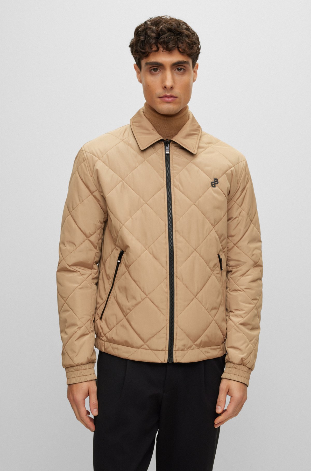 Water-repellent reversible quilted jacket with monogram trim