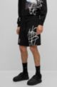 Relaxed-fit cotton shorts with graffiti-inspired logo, Black