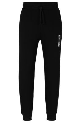 Hugo Boss Cotton-terry Tracksuit Bottoms With Vertical Logo In Black