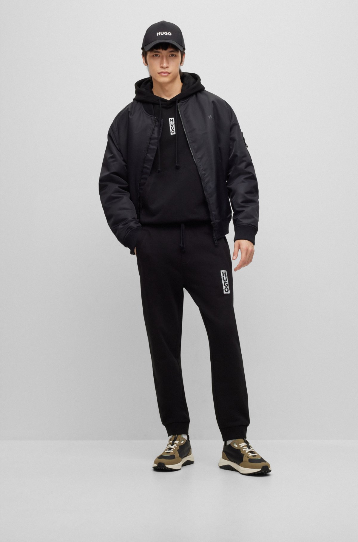 Cotton-terry tracksuit bottoms with vertical logo, Black